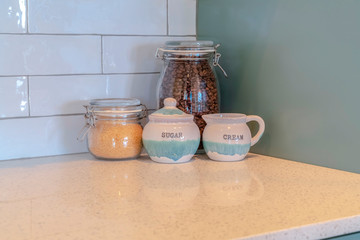 Glass kitchen storage jars with coffee and sugar