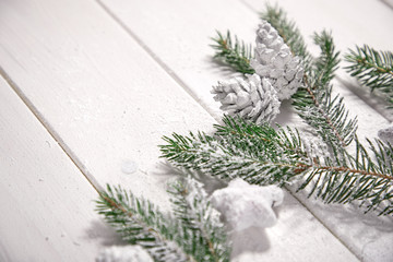 Christmas card - Christmas tree branches on the wooden background