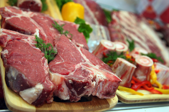 Raw meat on the butcher table