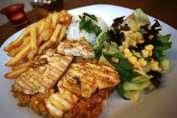 Grilled chicken with vegetables on the dinner plate