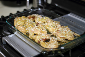 Marinated teriyaki chicken wings about to be baked in the oven.