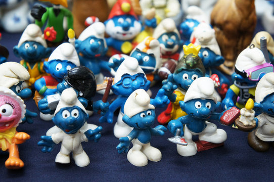 KUALA LUMPUR, MALAYSIA -DECEMBER 9, 2018:  Selective focused of fictional cartoon action figure Smurfs in miniature model displayed for the public on a desk. 