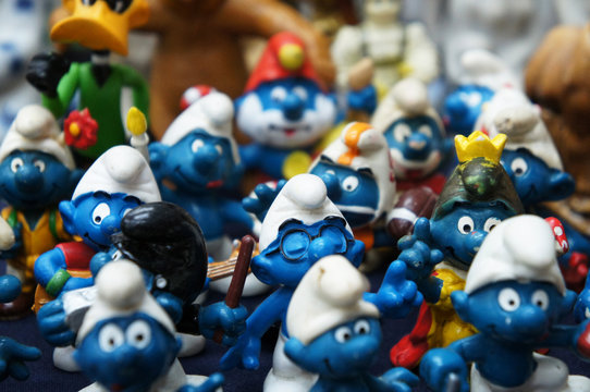 KUALA LUMPUR, MALAYSIA -DECEMBER 9, 2018:  Selective focused of fictional cartoon action figure Smurfs in miniature model displayed for the public on a desk. 