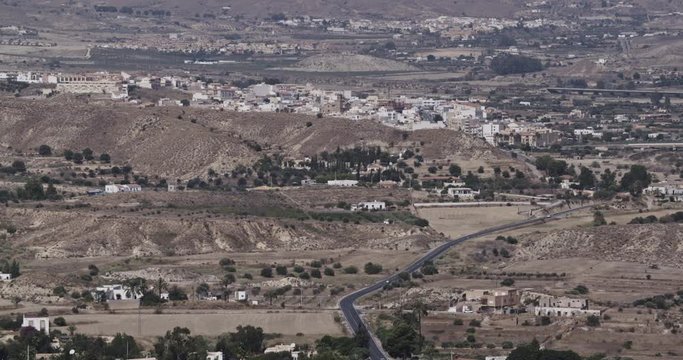 Establishing long shot of a valley near the town of Mojacar in Andalusia, Spain by summer.