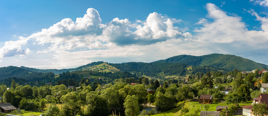 Fototapeta na wymiar Panoramic View of Carpathian Mountains in Summer Sunny Day. Bukovel, Ukraine