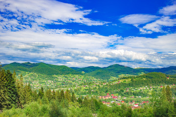 Fototapeta na wymiar Panoramic View of Carpathian Mountains in Summer Sunny Day. Mykulychyn, Ukraine