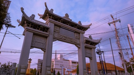 The big gate of the Chinese temple in the middle of the city