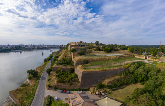 Aerial panorama view of Petrovaradin fortress trdava above the Danube River across from Novi Sad Serbia with lot of detail of the walls, ramparts and moats and blue sky
