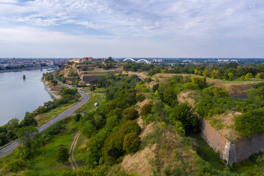 Aerial panorama view of Petrovaradin fortress trdava above the Danube River across from Novi Sad Serbia with beautiful blue sky