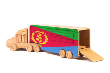 Close-up of a wooden toy truck with a painted national flag Eritrea. The concept of export-import,transportation, national delivery of goods