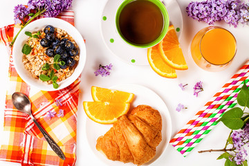  Muesli, blueberry, juice, tea and croissant