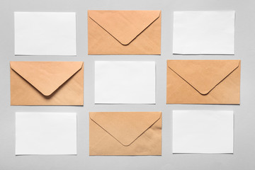 Invitations with envelopes on light background