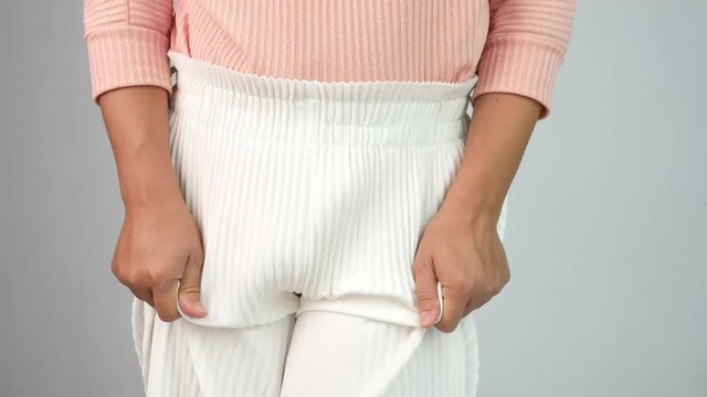 Asian women have problems with hidden spots, Have itching from vaginal discharge. Healthcare and medical concept.