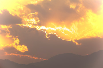 Angry yellow tone sky with mountain