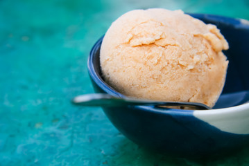Vanilla ice cream in a bowl with pastel background
