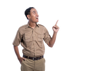 indonesia government worker with brown uniform pointing to copy space isolated