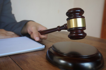 Legal counsel presents to the client a signed contract with gavel and legal law. justice and lawyer law of advisor Concepts