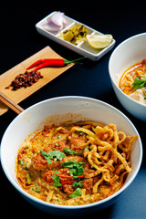 Khao Soi Chicken, a Thai food that is widely popular in the north along with the side dishes.