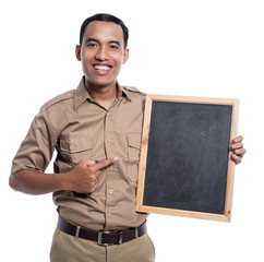 fun and excited indonesia worker with uniform holding blank blackboard isolated over white...