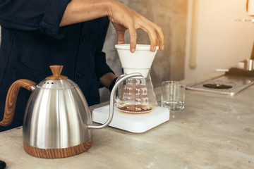 Barista brewing coffee, method pour over, drip coffee