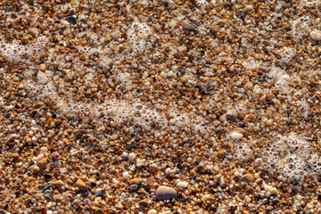 sea pebbles colored granite on the beach