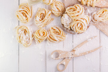 pasta with pasta ingredients on the dark wooden table top view