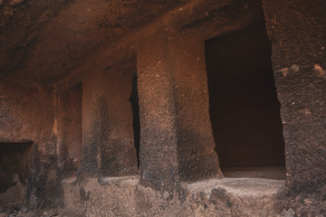 The Kanheri Caves are a group of caves cut into a massive basalt outcrop in the forests of the Sanjay Gandhi National Park, on the island of Salsette in the western outskirts of Mumbai, India.