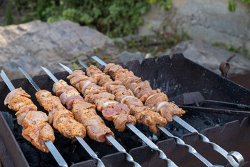 Fresh marinated kebab meat on skewers. Ready for frying on the grill.