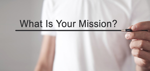 Man writes What Is Your Mission? text in screen.