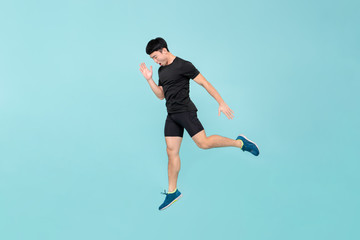 Fototapeta na wymiar Full body of energetic young athlete Asian man jumping