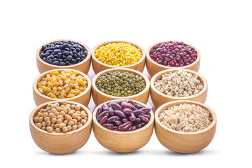 Cereal grains , seeds, beans on wooden background