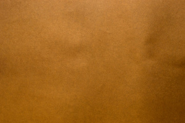 Dark brown paper surface. Suitable for use as a background.