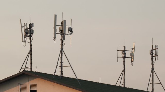 Small 5G Telecommunication Towers On top A House Roof