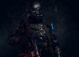 Portrait of man in amazing costume of dark apocalypse warrior with red and blue lights.