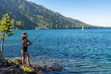 Woman Fishing in Lake Tahoe During Sunset