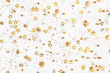 Christmas composition. Christmas golden decorations on white background. Flat lay, top view, copy space
