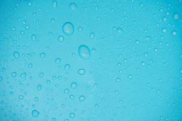 Water drops on blue background.