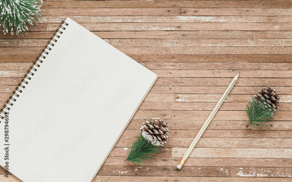 Aufkleber top view of blank notebook on grunge wood background with christmas decorations. mockup xmas backgro