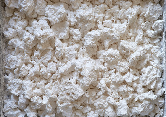 Chunky Calcium Chloride - white dehumidifying material.