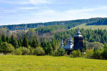 Blurred view of orthodox wooden church in Leszczyny, Low Beskids (Beskid Niski), Poland - obrazy, fototapety, plakaty