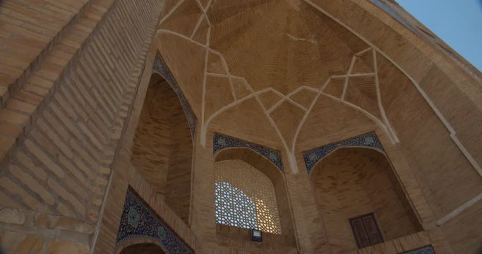 Muslim religious complex, mausoleum Hazrati Imam in Tashkent, Uzbekistan. The minarets that are close to the mosque about 50 meters high. Part of the medrese is now occupied by artisans. BMPCC4K