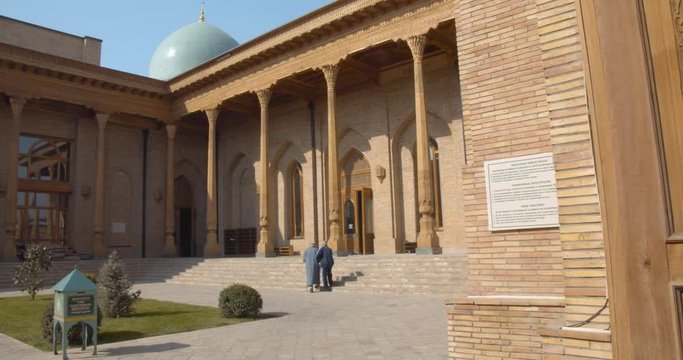 Muslim religious complex, mausoleum Hazrati Imam in Tashkent, Uzbekistan. The minarets that are close to the mosque about 50 meters high. Part of the medrese is now occupied by artisans. BMPCC4K