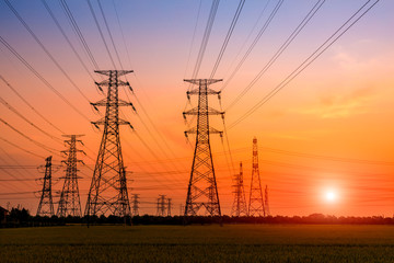 High voltage tower silhouette and sky landscape at dusk