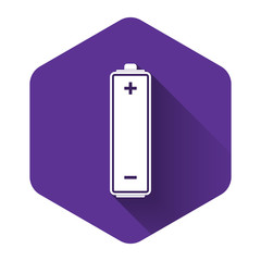 White Battery icon isolated with long shadow. Purple hexagon button. Vector Illustration