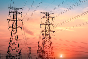 High voltage tower silhouette and sky landscape at dusk