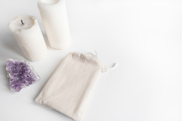 Mock up of tarot deck cotton bag, amethyst and candles on white background. Boho design of tarot...