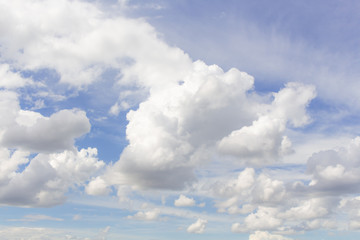 White cumulus clouds in blue sky at daytime. Natural background photo texture