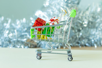 Gift box in the cart on bokeh background,