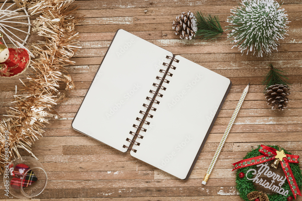 Aufkleber top view of blank notebook on grunge wood background with christmas decorations. mockup xmas backgro