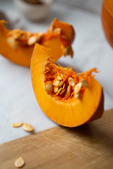 pumpkins with cinnamon sticks on marble backgrund